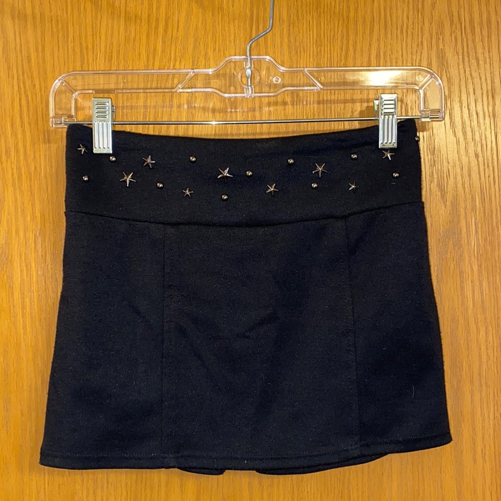 Women’s black miniskirt with gold studded detail